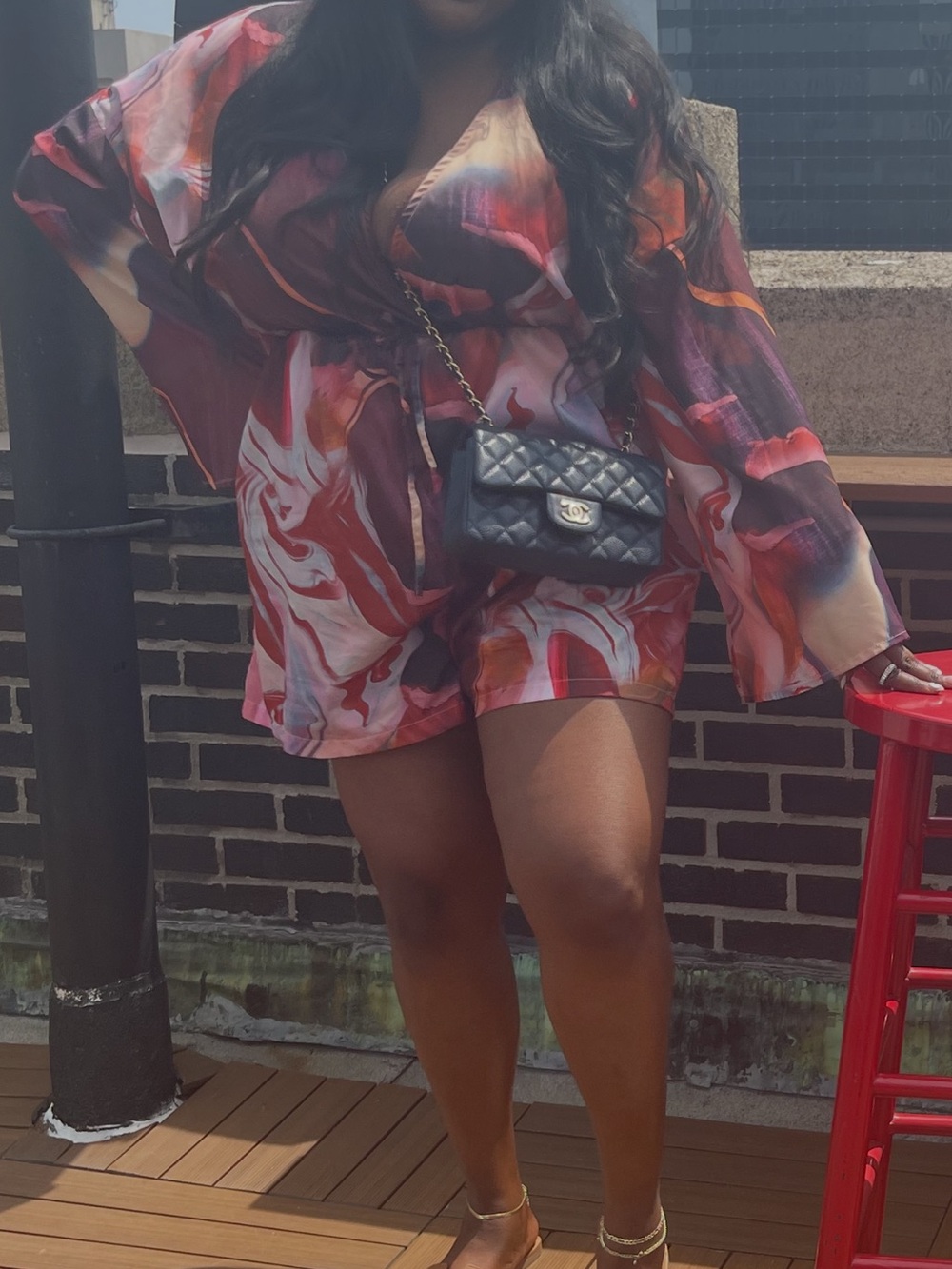 Vibrant Swirl Print Wrap Romper in Red and Purple